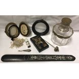 A box of various ornamental items including an ebony and ivory inlaid paperknife or page turner,