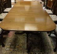 A modern mahogany rounded rectangular twin pedestal dining table in the George III taste (made at