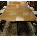 A modern mahogany rounded rectangular twin pedestal dining table in the George III taste (made at