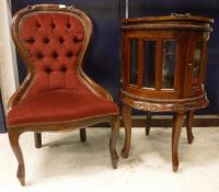 A reproduction mahogany salon chair, a mahogany and glazed drinks' cabinet of drum or barrel form,