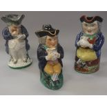 A 19th Century seated Toby jug with tricorn hat and jug of ale,