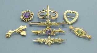 A collection of six 15 carat and 9 carat gold brooches, various,