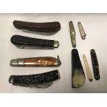 A collection of various pocket knives to include a Saynor antler handled "Real Lamb Foot",