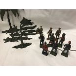 A box containing various painted lead soldiers, Britains and others, together with various trees,