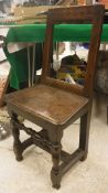 An 18th Century oak back stool,