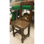 An 18th Century oak back stool,