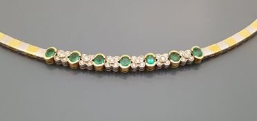 An 18 carat two tone gold emerald and diamond set necklace, total weight 34.