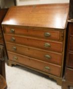 A 19th Century oak and mahogany cross-banded bureau with sloping fall front over four long drawers