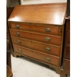 A 19th Century oak and mahogany cross-banded bureau with sloping fall front over four long drawers