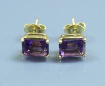 A pair of 18 carat gold set amethyst earrings