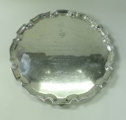 A 20th Century silver salver inscribed "Fina Presented to Sir Ralph Metcalfe by his colleagues on