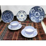 A 19th Century Delft charger and two Delft plates,