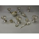 A collection of small silver wares to include two sauce boats, sauce ladle, dessert spoon,