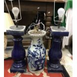 A pair of blue glazed pottery baluster column table lamps,