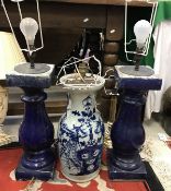 A pair of blue glazed pottery baluster column table lamps,