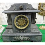 A Victorian black marble cased mantle clock of architctural form,