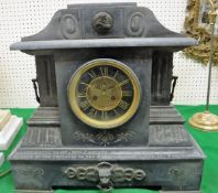 A Victorian black marble cased mantle clock of architctural form,