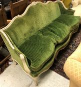 A 19th Century French painted framed sofa in the Louis XV style with green cord upholstery (N.B.
