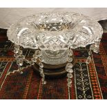 A Victorian cut glass table centre bowl on pedestal mount with plated stand raised on a Chinese