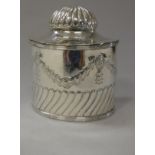 An Edwardian silver oval tea caddy,