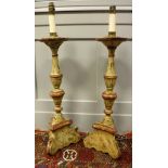 A pair of Italian painted and carved wooden altar type table lamps of candle form