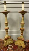 A pair of Italian painted and carved wooden altar type table lamps of candle form