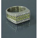 A 9 carat gold dress ring set with yellow and white diamonds 12 g