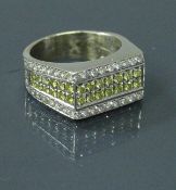 A 9 carat gold dress ring set with yellow and white diamonds 12 g