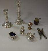 A collection of metal wares to include a pair of plated telescopic lamp candlesticks,