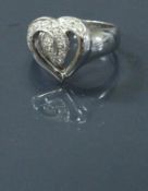 An 18 carat white gold and diamond set love heart dress ring 5 g