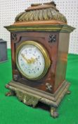 A 19th Century simulated tortoiseshell cased and brass embellished mantel clock,