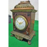 A 19th Century simulated tortoiseshell cased and brass embellished mantel clock,