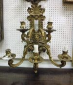 A 19th Century Continental cast gilt bronze wall sconce with five branches and mask decoration