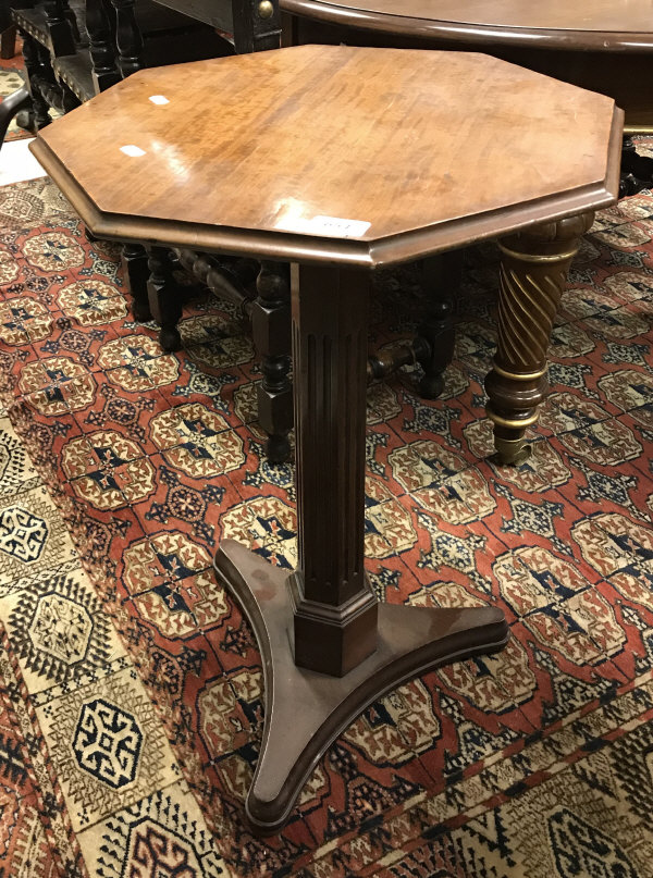 A 19th Century mahogany pedestal occasional table the octagonal top with moulded edge on a fluted