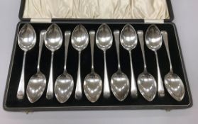 A cased set of twelve George V silver "Old English" pattern tablespoons (by Emile Viner,