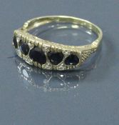 A 9 carat gold sapphire set ring, the sapphire of love heart shape 2.