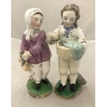 A pair of Derby type figures of fish sellers, she No'd to base 62,