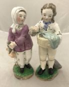 A pair of Derby type figures of fish sellers, she No'd to base 62,