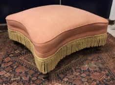 A Victorian upholstered drawing room stool, the rectangular top with waisted sides,
