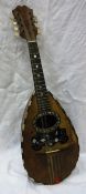 A circa 1900 mandolin with label to interior inscribed "Stridente fabrica di mandolini Via Antonio