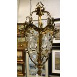 A 20th Century lacquered brass and glass bead latticework decorated ceiling light in the 19th