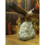 A circa 1900 Austrian cold painted bronze figure of a spread eagle upon a rock by Franz Bergman of