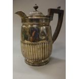 A Regency silver hot water jug with reeded decoration (by Rebecca Emes and Edward Barnard,