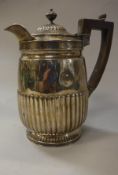 A Regency silver hot water jug with reeded decoration (by Rebecca Emes and Edward Barnard,