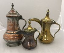 A Turkish engraved brass coffee pot,