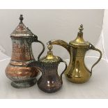 A Turkish engraved brass coffee pot,