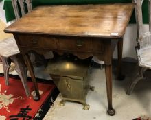 An 18th Century walnut and cross-banded lowboy, the plain top above single drawer to shaped apron,