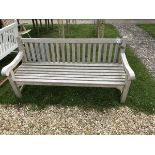 A Barlow Tyrie teak slatted table together with a set of four teak neptune folding chairs,