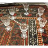 A collection of facet cut glass wines on hexagonal splayed bases (26) CONDITION REPORTS