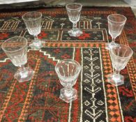 A collection of facet cut glass wines on hexagonal splayed bases (26) CONDITION REPORTS